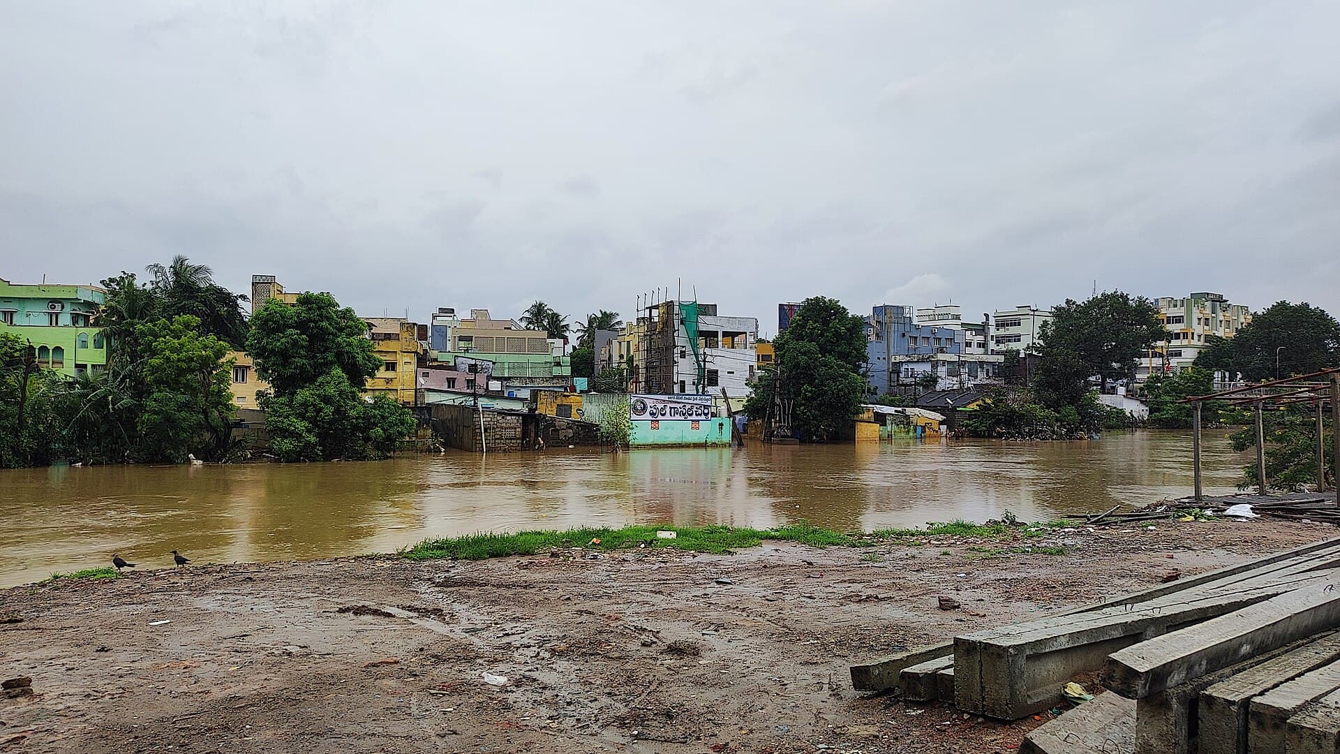 Floodwater from the Budameru beside homes in Vijayawada.